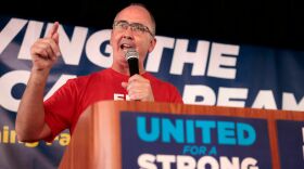 UAW President Shawn Fain speaks as UAW members and their supporters gather for Solidarity Sunday at the UAW Region 1 office in Warren, Mich., on Aug. 20. The UAW has started an unprecedented strike against all three big automakers.