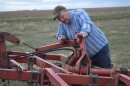 Sen. Jon Tester, D-Mont., works on his farm in Big Sandy, Mont., in 2017.