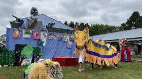 Large puppets in a theatrical setting