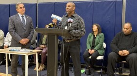 Keshawn Dodds, executive director of the Boys and Girls Family Center, holds up a new universal city pass in Springfield, Massachusetts, on September 25, 2023.