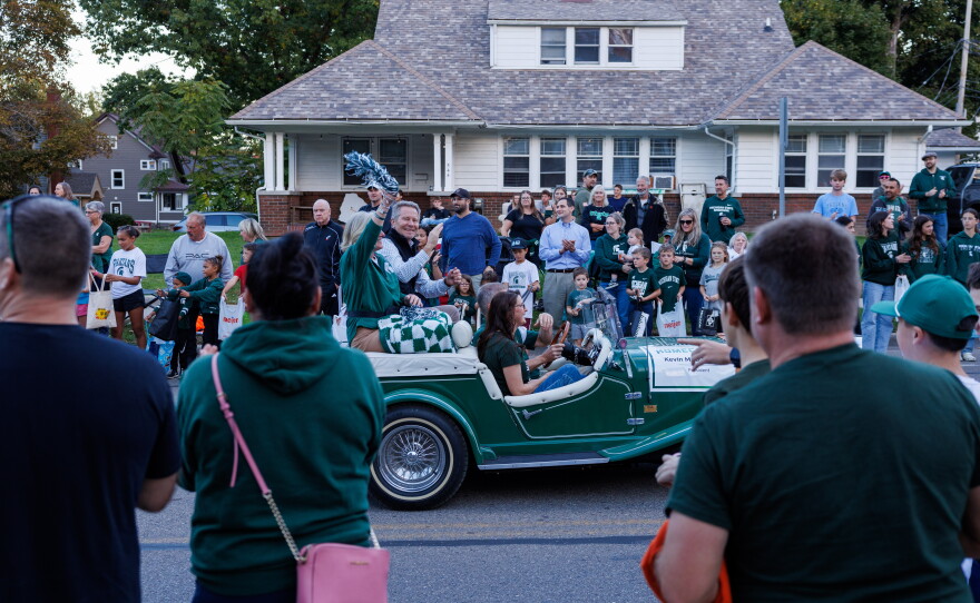 Michigan State University President Kevin Guskiewicz waves to attendees of the Michigan State University Homecoming Parade in East Lansing, Mich., on Oct. 9, 2026.