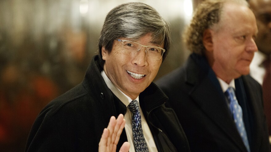 In this Jan. 10, 2017, file photo, pharmaceuticals billionaire Dr. Patrick Soon-Shiong waves as he arrives in the lobby of Trump Tower in New York for a meeting with President-elect Donald Trump. Soon-Shiong will take over the L.A. Times on Monday.