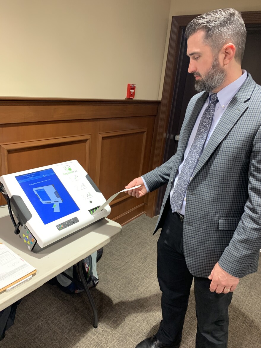 Chris Whitmire of the South Carolina Election Commission has been showing voters how to use the state's new equipment.