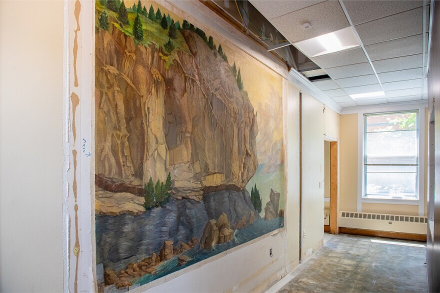 The painting of Lone Rock Point by Burlington artist Raymond Pease, created in the 1930s and sealed behind a wall in the 1990s, was re-discovered during renovations at UVM in May.