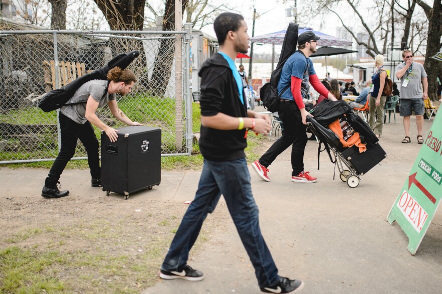 Day One DIY: Musicians load equipment in East Austin.
