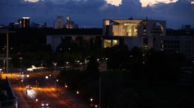 Traffic passes the mostly-dimmed German federal Chancellery in the evening on September 10, 2022 in Berlin, Germany. (Adam Berry/Getty Images)