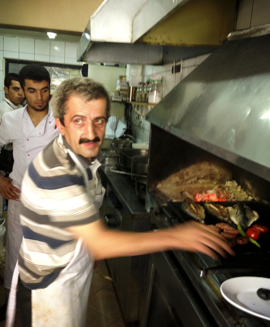 Sabri, a 25-year veteran of the grill, works in the kitchen at Akin Balik restaurant in Istanbul.