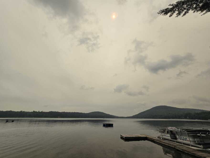 Smoky haze over Sand Pond in Lempster, New Hampshire, on July 15, 2026. The state Department of Environmental Services issued a smoke advisory through Thursday, July 15, due to smoke from wildfires in Canada blowing through New England.