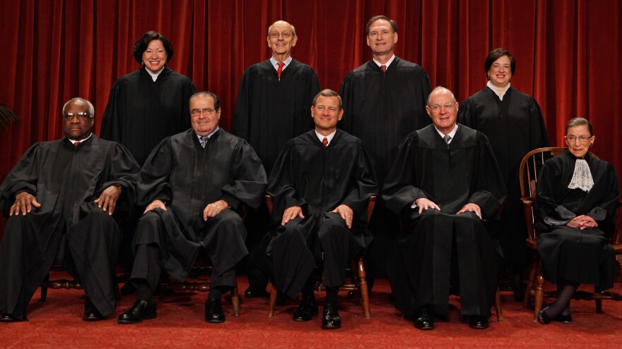 The U.S. Supreme Court justices (first row, from left) Clarence Thomas, Antonin Scalia, Chief Justice John Roberts, Anthony Kennedy, Ruth Bader Ginsburg, (back row) Sonia Sotomayor, Stephen Breyer, Samuel Alito and Elena Kagan — pose at the Supreme Court in 2010.