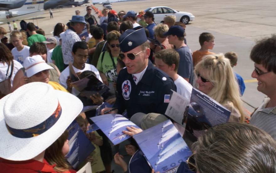 Commander Lt. Col. Richard “Spad” McSpadden, commander and leader of the US Air Force Thunderbirds aerial demonstration team signs autographs for spectators and fans during open house at Eglin Air Force Base in Florida. (Joe Piccorossi/U.S. National Archives)