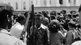 Armed members of the Black Panther Party leave the Capitol in Sacramento on May 2, 1967. (AP)