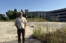 Tyler Norod, president of the Westbrook Housing Development Corporation, stands at the future site of Quebec Commons, a 45-unit apartment building for older Mainers that's planned for Biddeford's historic mill district.