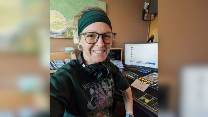 Woman at a radio station console