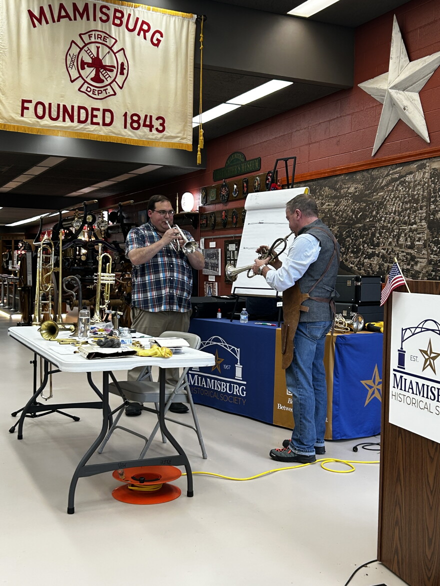 Pictured here is George Schlub and Josh Omaits playing hand-crafted instruments at Miamisburg History Center.