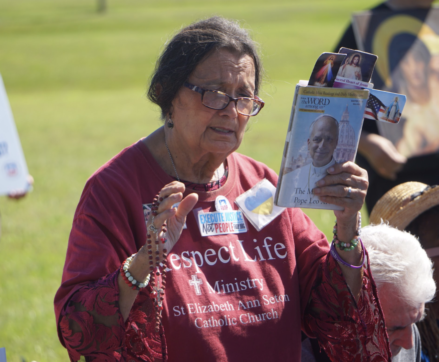 Hilda Rausini said she didn’t want to move to Florida because she knew it had the death penalty. “Only God can kill,” she said at a prayer vigil outside the Florida State Prison in Raiford, Fla. Tuesday, Oct. 13, 2026. (Alexa Ryan/WUFT)