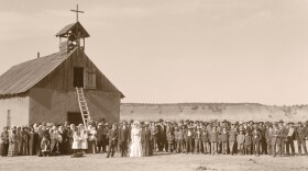 Ramon and Adela (Quintana) Gallegos wedding photograph. Taken in front of the first Santa Rosa Church, Rosa, NM, 1912.