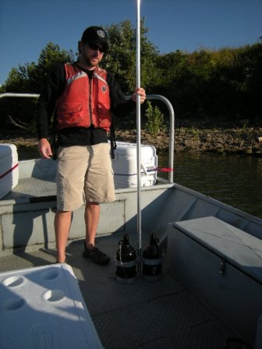 Researcher collecting water samples
