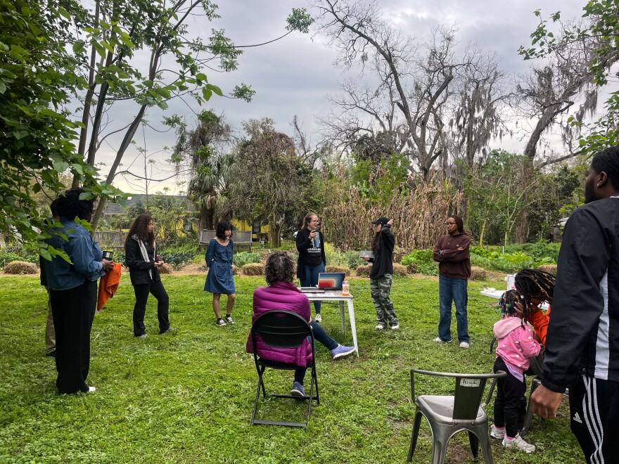 Attendees gather in a circle to discuss the tool and the issue of gentrification in general. The discussion was an open forum for everyone to share their thoughts. (Hannah Getman/WUFT News)