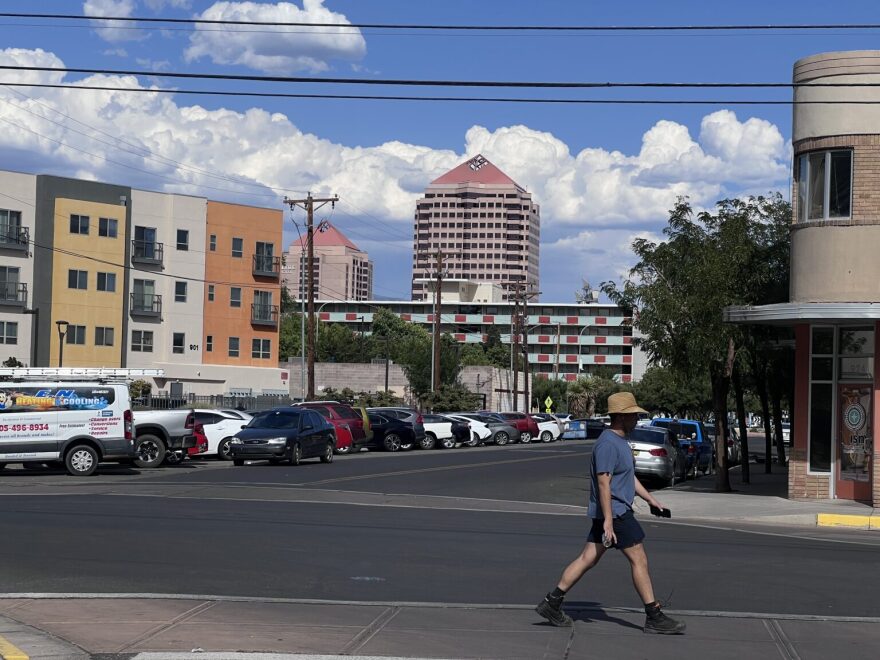 A man in a large, straw hat strolls during 100-degree temperatures in Downtown Albuquerque on Wednesday afternoon. An early-August heat wave is affecting much of the state, and it’s not clear when we can expect monsoons.