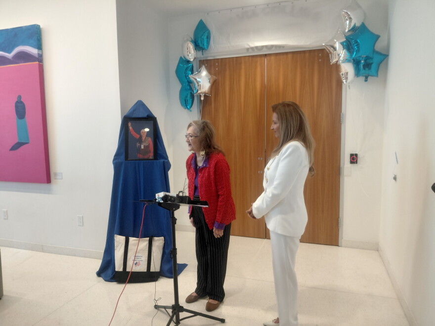 Community activist Frances Rizo and Dallas County Commissioner Elba Garcia spoke at the dedication of the Sylvia Collins Room at the Oak Cliff Government Center Tuesday morning. Collins died in a May 28 fire at The Clyde apartments in Oak Cliff.