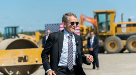 Intel CEO Pat Gelsinger runs across the construction site at the groundbreaking of the new Intel semiconductor manufacturing facility.