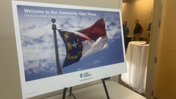A welcome sign featuring the North Carolina flag outside a Duke Energy open house
