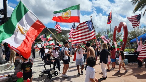 People celebrating the possible end of the Islamic Republic in Iran chanted and danced during a rally near City Hall in Orlando Sunday.