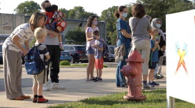 Parents drop their children off at Rogers Elementary School for the first day of the 2021-22 school year on August 4. Students, visitors and staff must wear masks while at MCCSC schools.