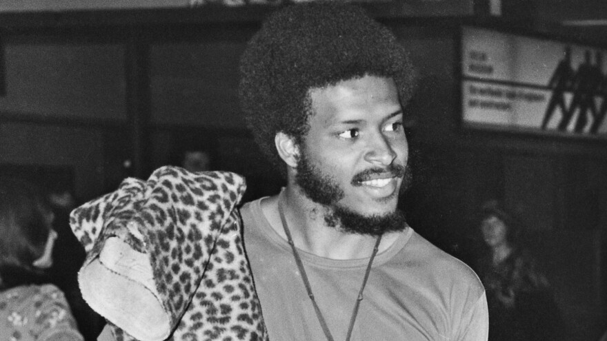 James Mtume, left, and Miles Davis arrive at Heathrow Airport in London on July 10, 1973.