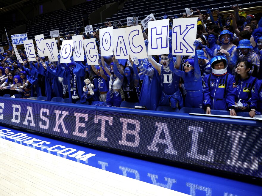 Fans hold up a sign for Head Coach Mike Krzyzewski of the Duke Blue Devils before he coaches his final home game at Cameron Indoor Stadium against the North Carolina Tar Heels on Saturday.