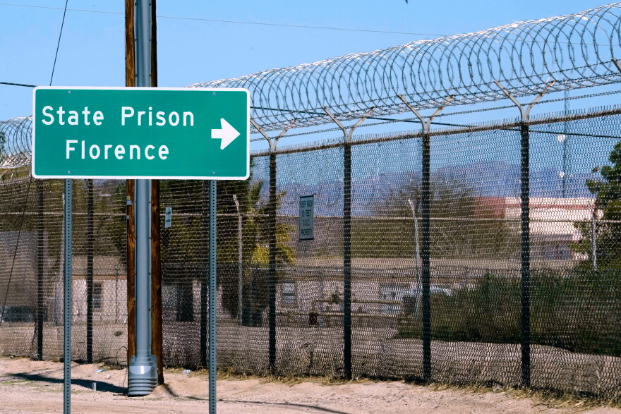 A sign points in the direction of the Arizona State Prison in Florence, Ariz., March 19, 2025.