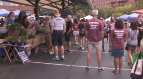 Several members of the community protested against white supremacy at the Bloomington Farmers' Market last year. On Monday night, activists say they will boycott the market until Schooner Creek Farm is banned as a vendor.
