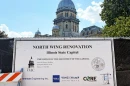 A sign shows the parties involved in construction on the north wing of the Illinois State Capitol.
