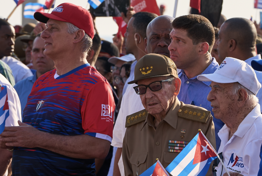 Raúl Castro (center, in green fatigues) at an international workers day celebration in Havana on May 1, 2026, with Cuban President Miguel Díaz-Canel (to Castro's right).