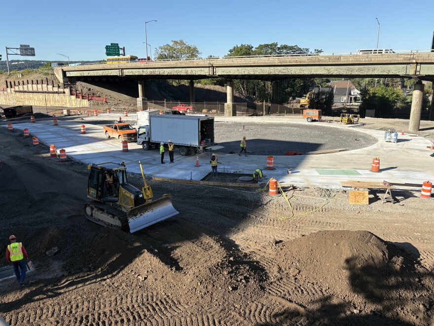 Crews work on the roundabout at Van Buren and Almond Streets, which takes traffic to ground level and the community grid once the viaduct comes down.