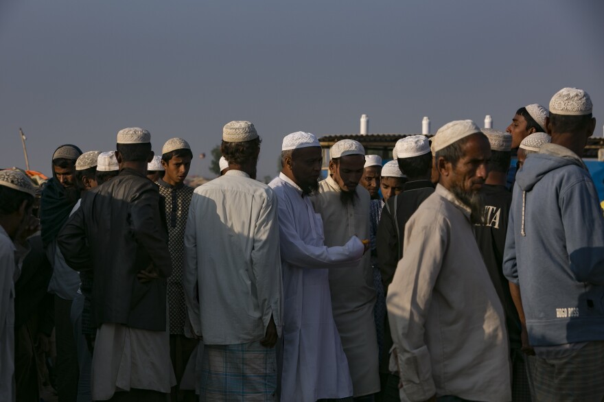 Men congregate after prayers in a makeshift mosque in the Hakimpara refugee camp.