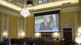 Former U.S. President Donald Trump is displayed on a screen during the fourth hearing on the January 6th investigation.