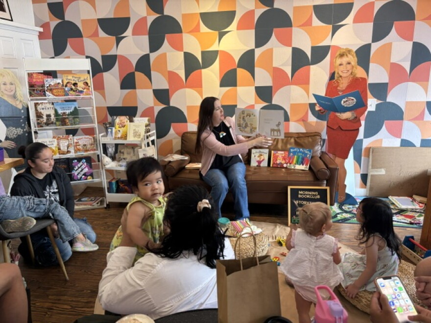 Jessica Knight reads to the children that participated in the Morning Book Club and Poetic Republic, a coffee shop in Southtown. Imagination Library sponsored the gathering.