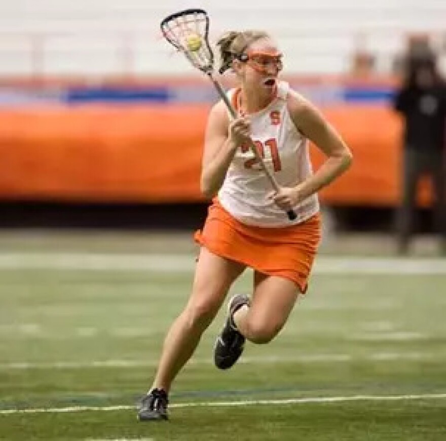 Katie (Rowan) Thomson (21, White) attacking cage while playing for Syracuse from 2006-2009.