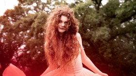 a woman in a dress posing for a photo