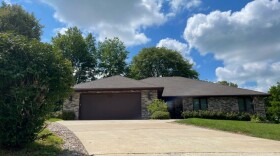 A central Iowa nurse is accused of attempting to exploit a potential gap in state regulation by running an illegal, unlicensed care facility out of this house in Des Moines.
