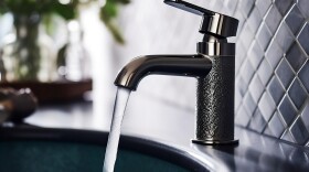 Water streaming from a faucet.