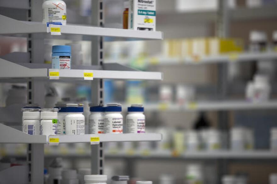 Prescription drugs on a shelf.