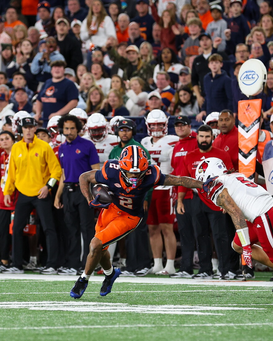 Syracuse wide receiver Umari Hatcher (2, Blue) makes a defender miss after one of his 13 receptions, a career-high.