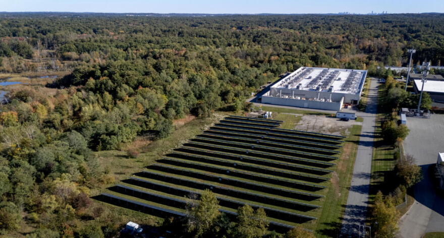 Equinix's data center and solar panel array at the company’s facility in Billerica, Mass.  (Robin Lubbock/WBUR)