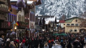 Locals and tourists make their way up and down Front Street in downtown Leavenworth during the first weekend of Leavenworth's Village of Lights on Saturday. Nov 26 2022