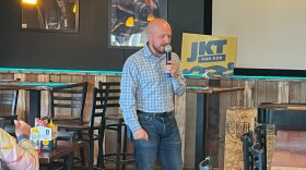 Gubernatorial candidate Jonathan Kreiss-Tomkins speaks with residents during his meet-and-greet at the Norwegian Rat Saloon on July 18.