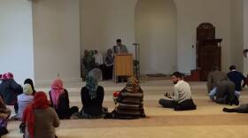 ISNA Communications Director Edgar Hopida leads weekly prayer before program honoring Abdul-Rahman Kassig.