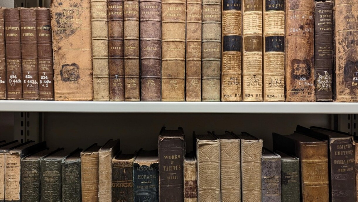 Old books on shelves.