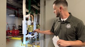Chief Environmental Specialist Adam Sears shows water damage from a leaking pipe system in the Franklin County Municipal Court basement.